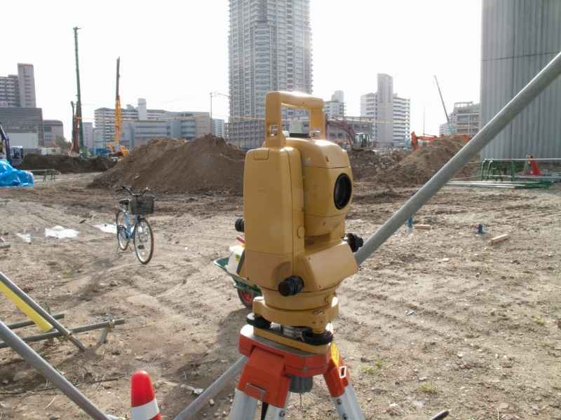Survey mapping with a total station on a commercial development site in Midland, Texas.